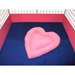 Pink heart in cage